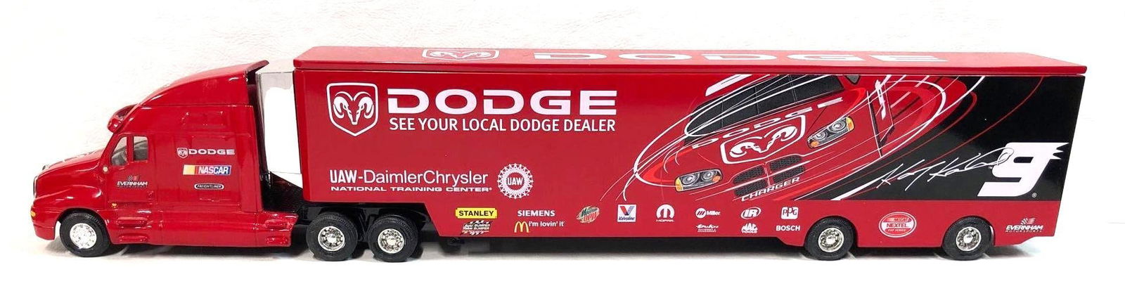 Evernham Motorsports 1:64 Replica Nascar #9 Kasey Kahne Dodge Charger Transporter Hauler: Evernham Motorsports 1:64 Diecast Replica Nascar #9 Kasey Kahne Dodge Charger Transporter Hauler. It measures approximately 13-1/2" x 2-3/4" x 1-1/2" and it weighs 1.8lbs. The Nascar Repli