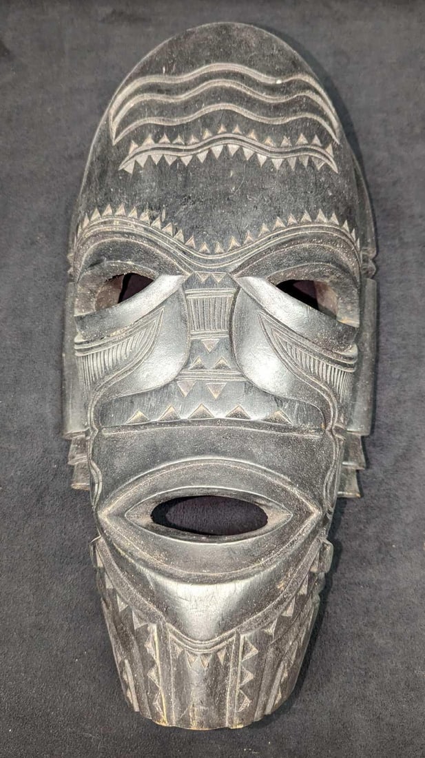 Hand Carved Wooden Tribal Botswana Art Mask: Hand Carved Wooden Tribal Botswana Art Mask. This is approx 8" x 4" x 16 1/4" and it weighs 4.05 lbs. The mask has some scratches and markings. Please see the images as they are part of th