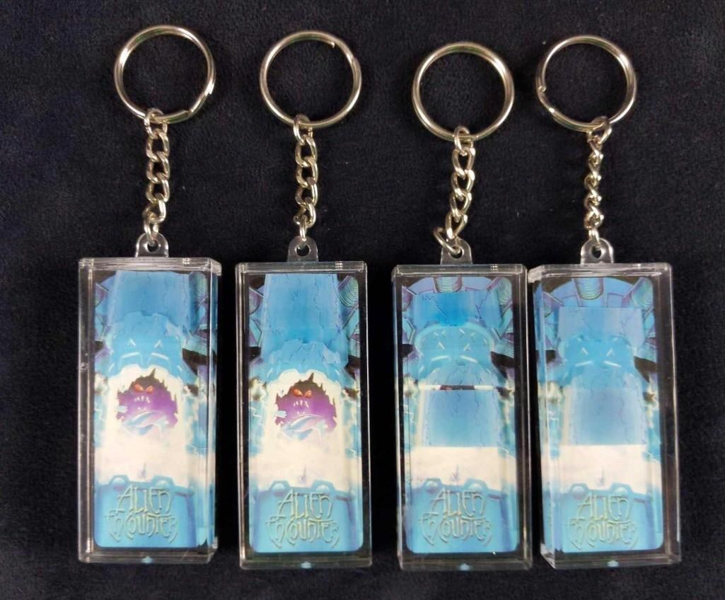 4 Vintage Disney World Alien ENcounter Keychains: 4 Vintage Disney World Alien ENcounter Keychains. Four keychains from the short-lived "ExtraTERRORestrial Alien Encounter" attraction at the Walt Disney World Resort in Orlando, Florida. Keych