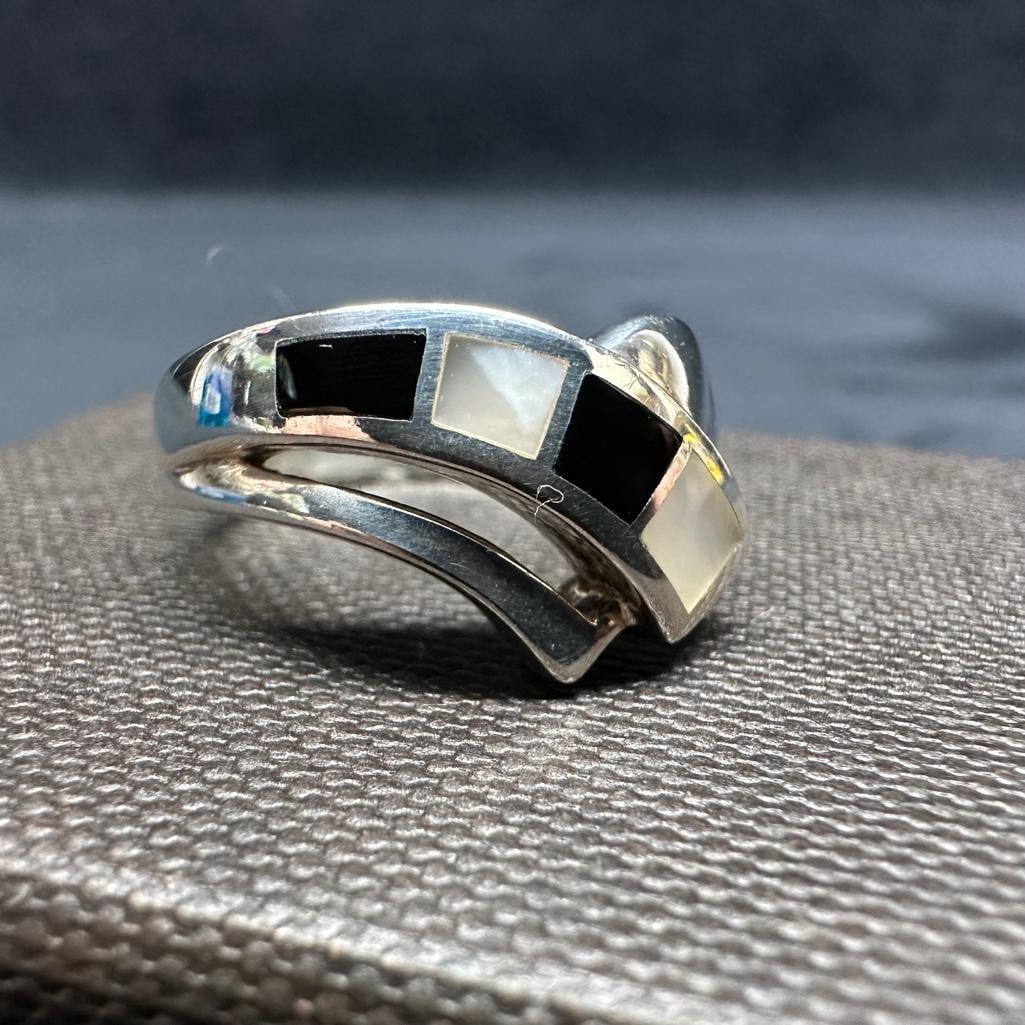 Sterling Ring With Mother of Pearl & Onyx Mosaic: This piece of jewelry has been tested and researched prior to listing. Please view all our pictures they are part of our description. DETAILS: Metal - Sterling Silver Color - Silver Stones - Mother of