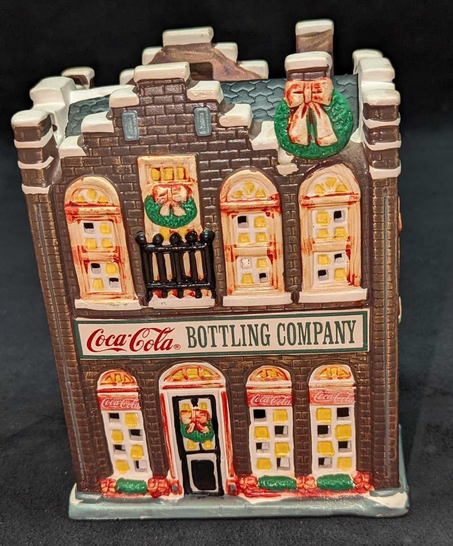 Coca-Col Lighted Town Square Bottling Company: Coca-Cola Lighted Town Square Bottling Company. Comes in the original box that is approx 8 3/8" x 5 1/4" x 8 1/4" and it weighs 1.90lb. Made of a ceramic. The lighting fixture was tested a