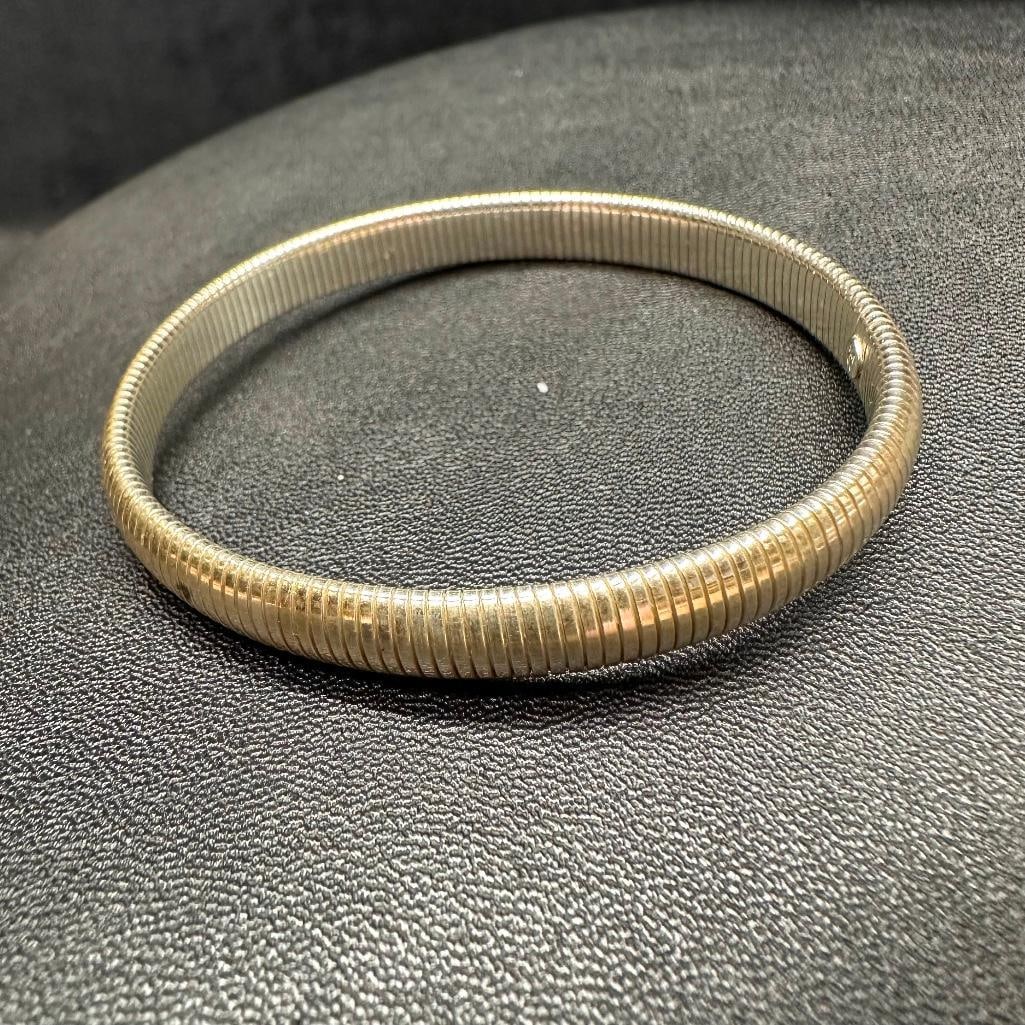 Sterling Silver Stretch Bangle: This piece of jewelry has been tested and researched prior to listing. Please view all our pictures they are part of our description. DETAILS: Metal - Sterling Silver Color - Silver Stones - none Hall