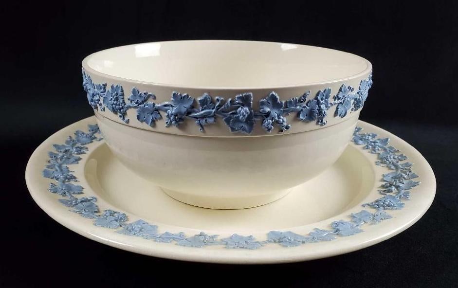 Wedgwood Queensware Blue On Cream Bowl And Platter: Wedgwood Queensware Blue On Cream Bowl And Platter. This lot includes retired Fine China by Wedgwood. Both have a blue textured grapevine on cream design. Series was sold from 1930 - 1988. (1)Wedgwood