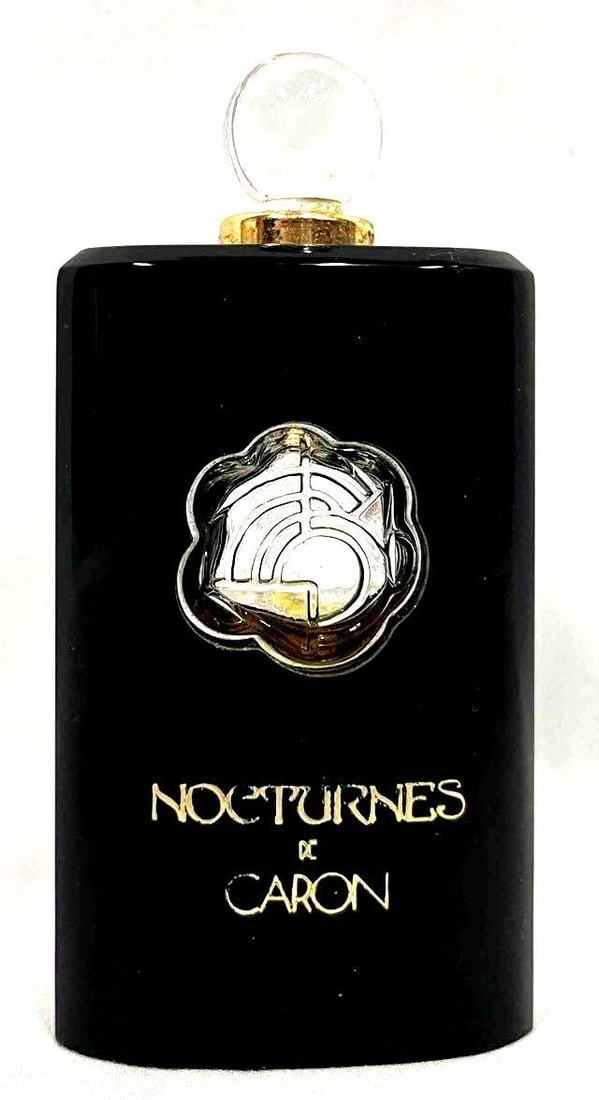 Caron Nocturnes De Caron Mini Perfume Empty: This lot contains a Caron Nocturnes De Caron Mini Perfume Empty. It is approx 1 3/4" x 3/4" x 3 1/4" and it weights about 1.2oz. Made in France. Overall vintage perfume bottle is in good u