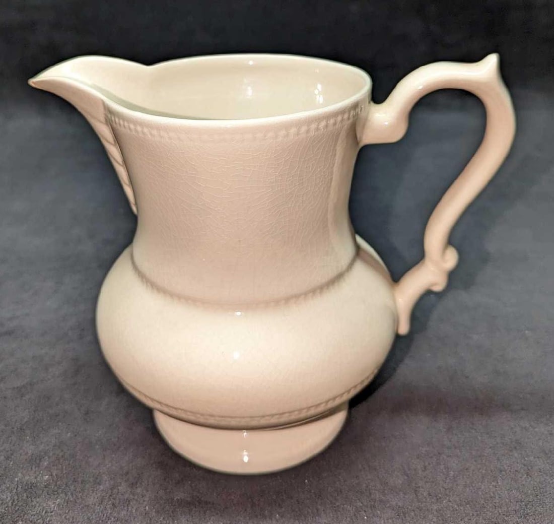 Vintage Barrington Ironstone Pitcher: Vintage Barrington Ironstone Pitcher. This is approximately 8 1/2" x 6" x 6 1/2" and it weighs 1.50lb. The pitcher has crazing and there is a chip on the sprout. There is also some marking