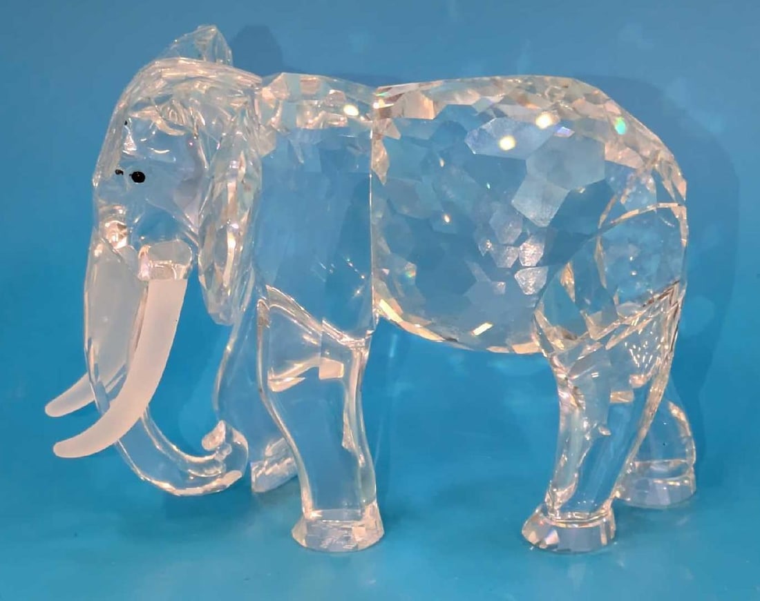 Swarovski Crystal Inspiration Africa The Elephant With Box: Swarovski Crystal Inspiration Africa The Elephant With Box. The elephant is approx 4 1/2" x 3 1/2" x 3 1/8". It comes with the original box that is approx 7 5/8" x 7 1/2" x 6 1/2&#