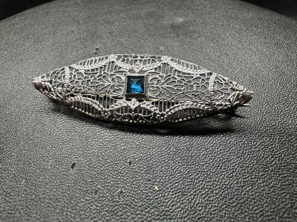 Sterling London Blue Topaz Filigree Brooch: This piece of jewelry has been tested and researched prior to listing. Please view all our pictures they are part of our description. DETAILS: Metal - Sterling Silver Color - Silver Stones - Topaz (Lo