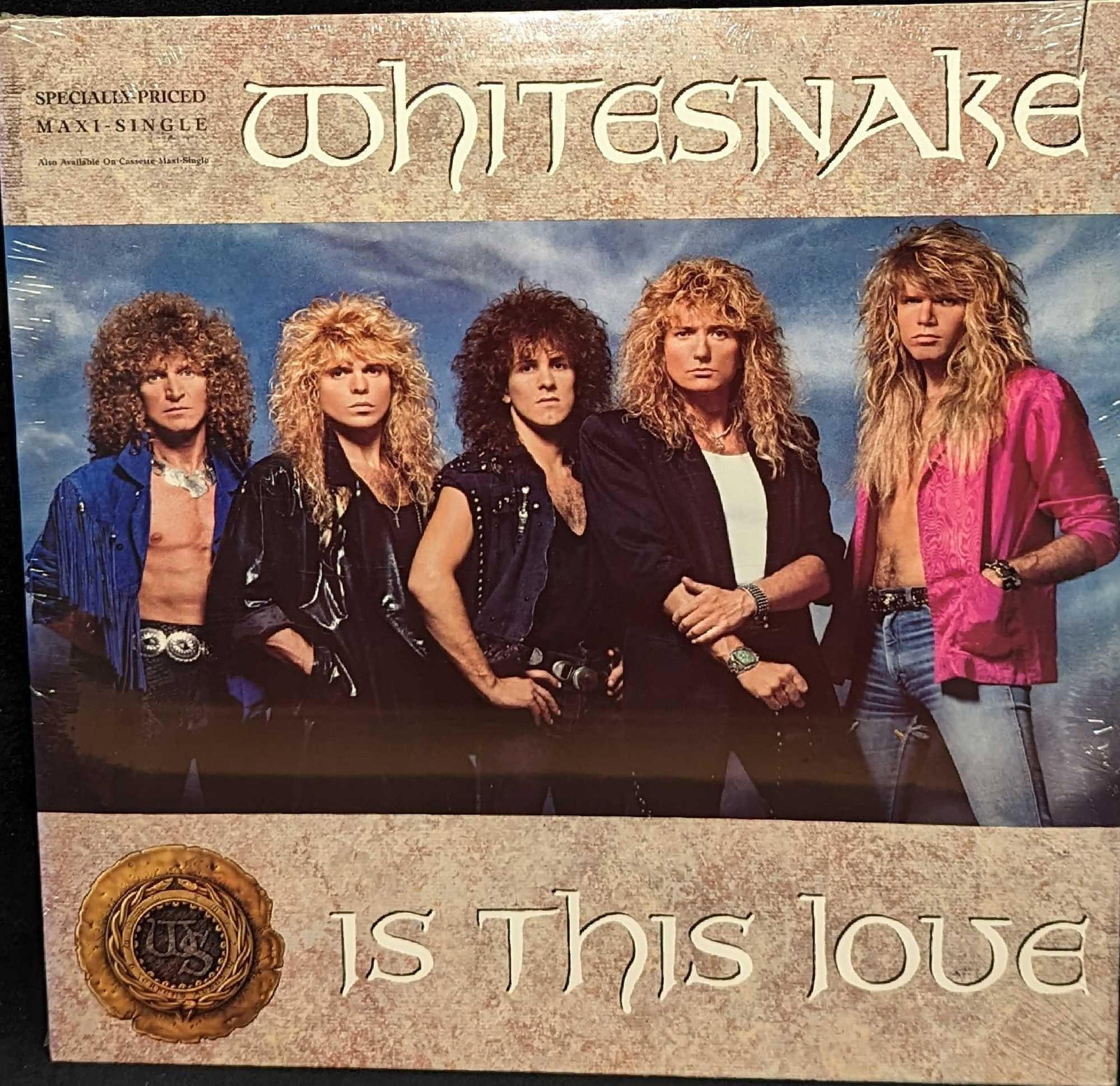 Sealed Whitesnake 'Is This Love' 1987 Maxi Single: Sealed Whitesnake 'Is This Love' 1987 Maxi Single. Is approx 12 1/4" 1/8" x 12 1/4" and it weighs 0.44lb. The sealed LP has a saw tooth cut on the top of the jacket. 