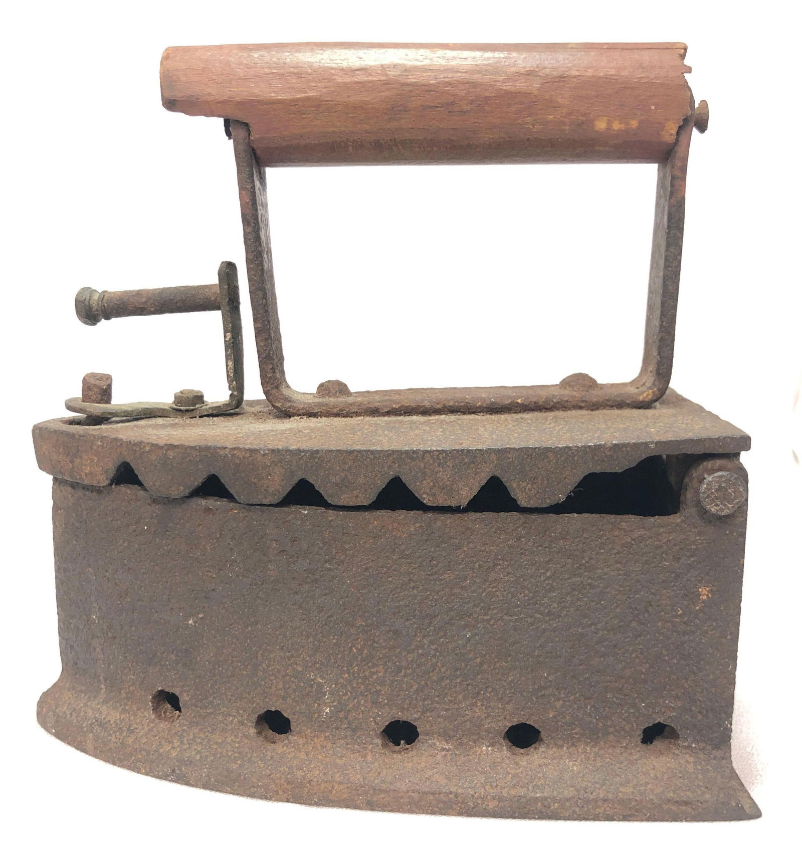 Antique Cast Iron Vented Charcoal Sad Iron Press: This lot contains Antique Cast Iron Vented Charcoal "Sad Iron" Press with Wooden Handle. It is approx 7-3/4" x 7-1/4" x 4" and weighs about 5.0lbs. Overall the Sad Iron is in fair used condition with
