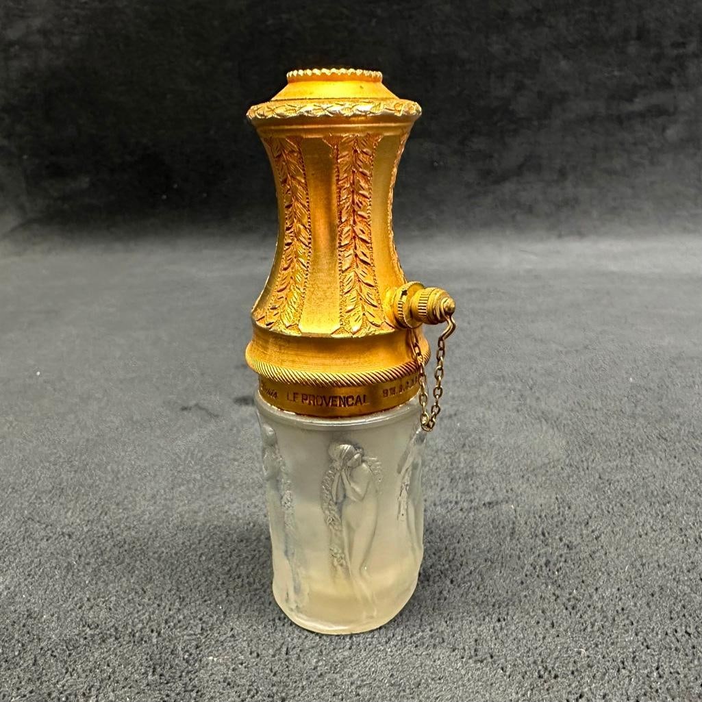 Lalique "Le Provencal" Molinard Small Atomizer: Lalique "Le Provencal" Molinard Small Atomizer Lalique atomizer made for Molinard, with a metal atomizer top and glass bottle. Features nude women around the bottle, and has a faint stamped si