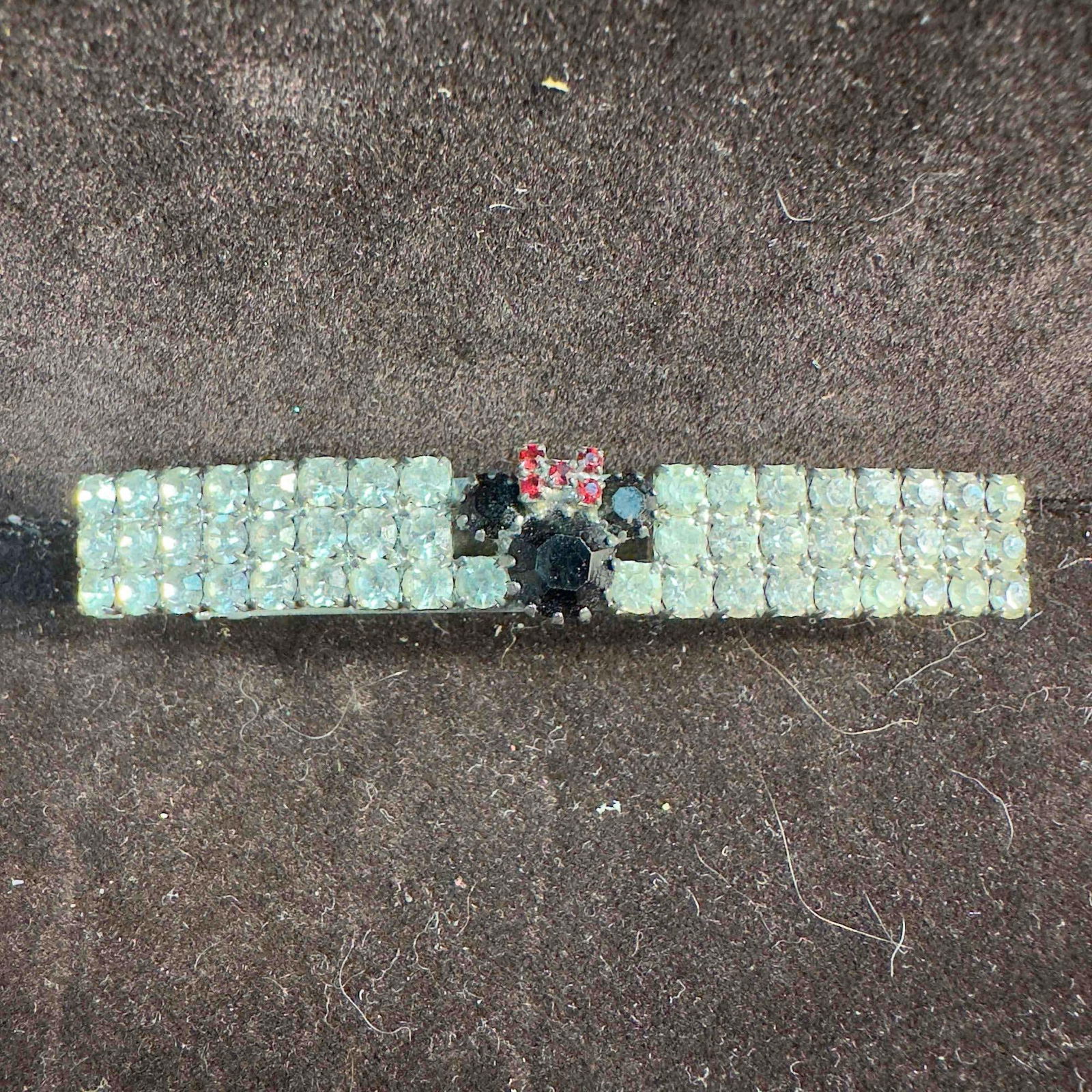 Minnie Mouse Rhinestone Crystal Hair Clip Band: Minnie Mouse Rhinestone Crystal Hair Clip Band. This hair clip features white, red, and black rhinestone crystals in a Minnie Mouse shape theme. Made in France etched on the clip. This item is in good