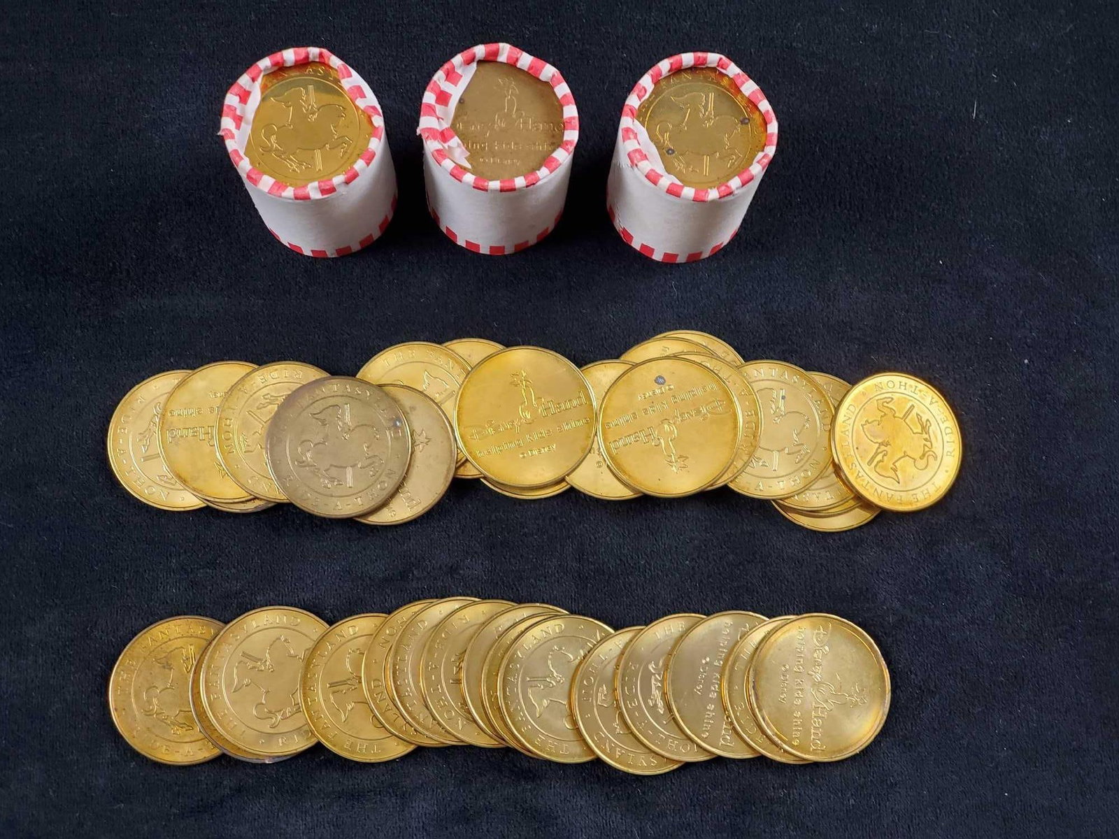 DIsney The Fantasyland Ride-A-Thon Coin Lot Of 110: Given to participants of the Fantasyland Ride-A-Thon. Was a 2004 charity event at the Magic Kingdom. Front of the brass coin features a raised image of a Carousel horse. Back of the coin reads "