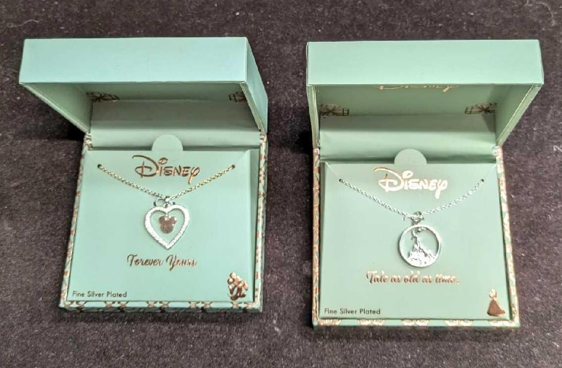 2 Disney Beauty And The Beast & Mickey Mouse Necklaces: 2 Disney Beauty And The Beast & Mickey Mouse Necklaces. This lot includes two silver plated necklaces with pendants. One is called "Forever Yours" and has a heart and mickey mouse head, and the other 