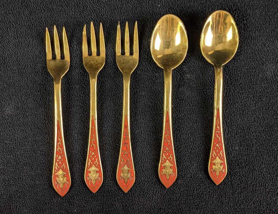 Vintage Thai Gold Toned Cocktail Forks and Spoons: Vintage Thai Gold Toned Cocktail Forks and Spoons Three forks and two spoons Some of the tips of the fork have been slightly bent. They have Siam pressed on the back meaning they are from Thailand. Th