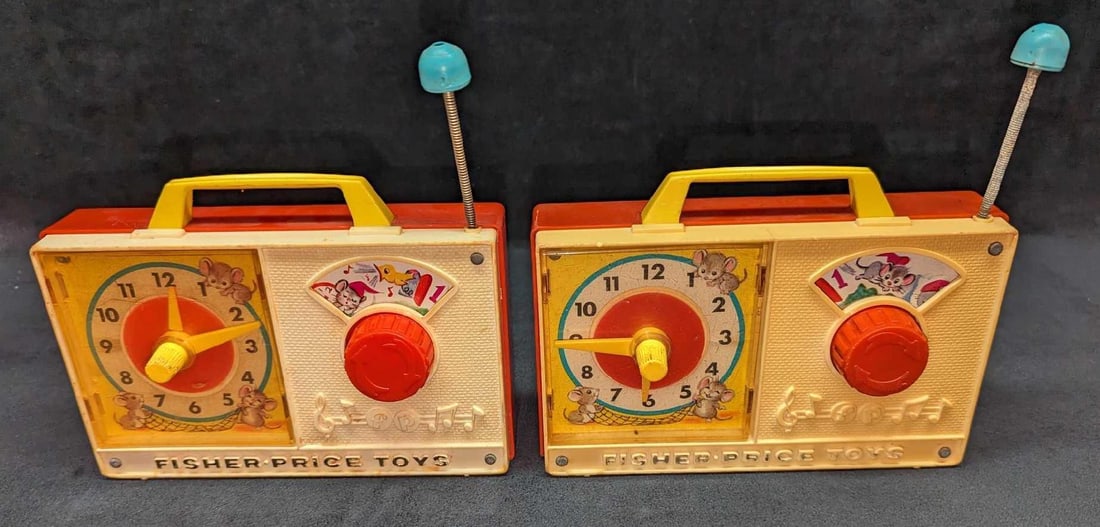 Vintage Fisher Price Toys Dickory Dock Music Box: Vintage Fisher Price Toys Dickory Dock Music Box. When the knob is turned, the music starts, the clock's hands move, and the graphic above the knob moves. One fully works, while the other does not. Ea