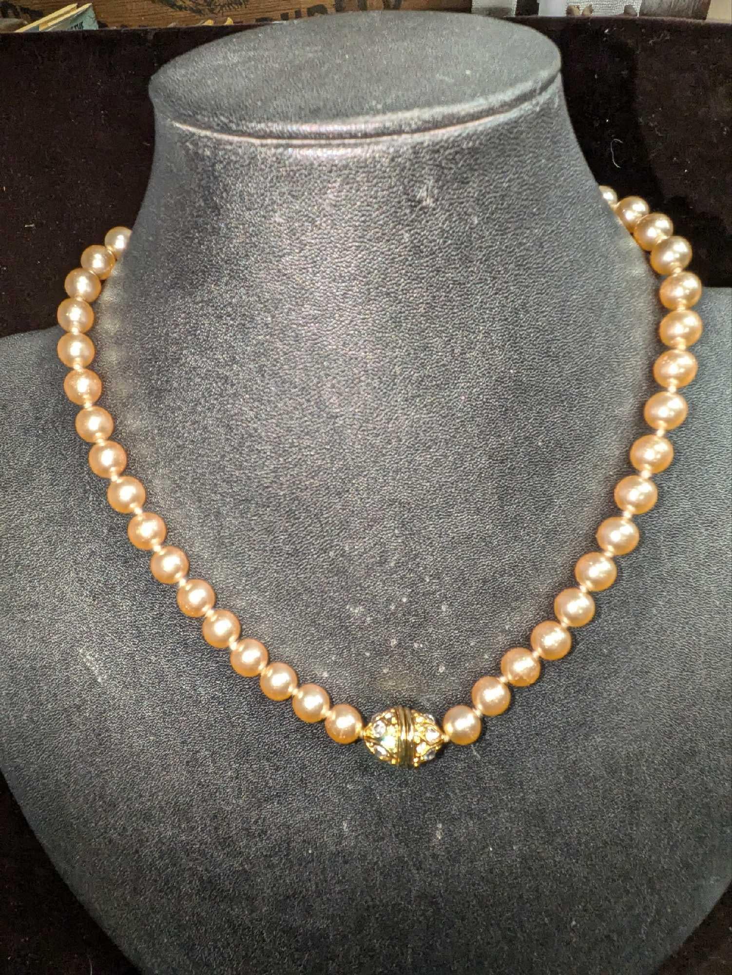 Nolan Miller Faux Champagne Pearl Rhinestone Choker: Nolan Miller Faux Champagne Pearl Rhinestone Choker. This is approx 18". This comes in a bag that is approx 3" x 1/2" x 4 1/2" and it weighs 