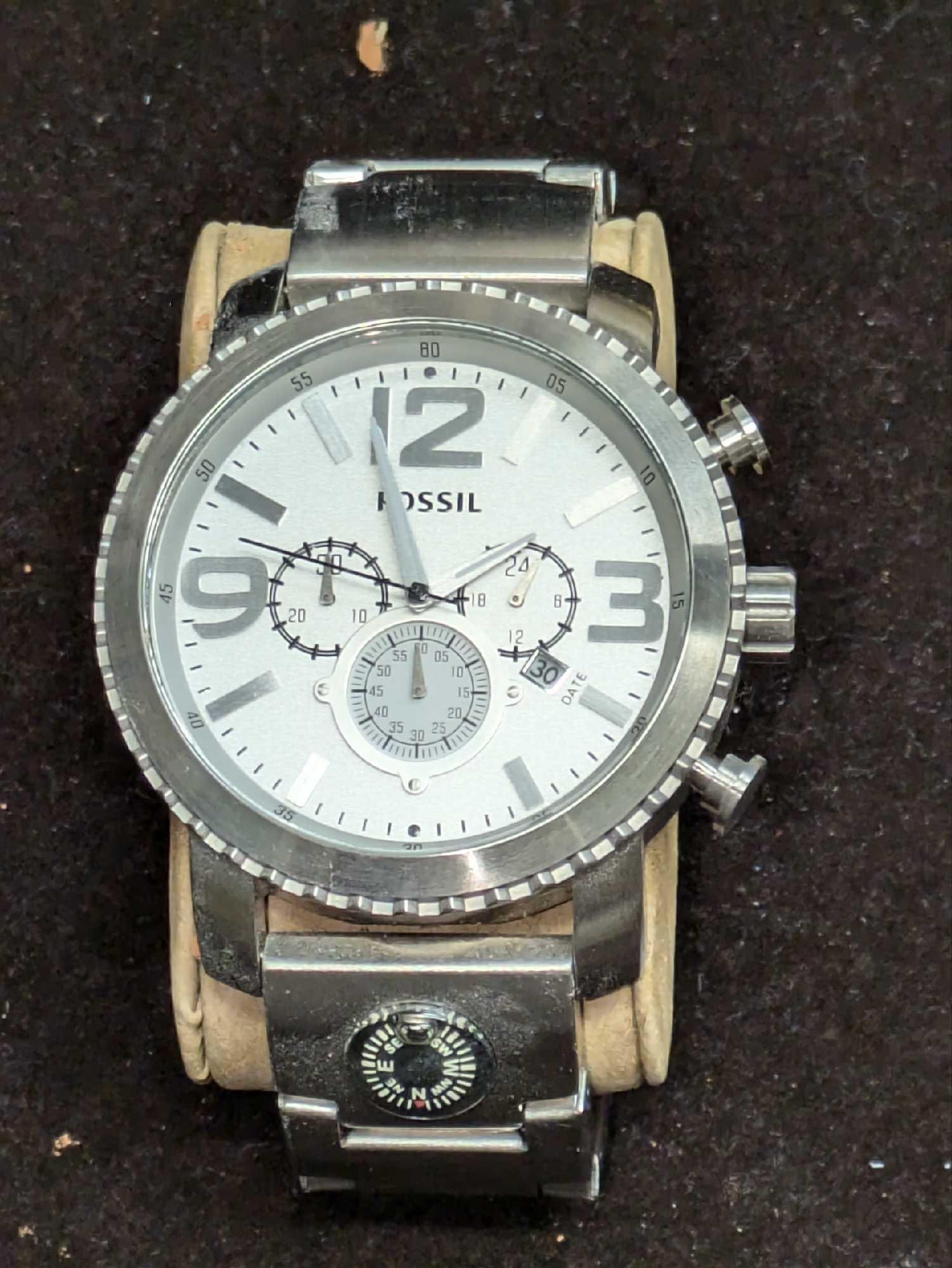 Fossil Men's Gage Compass Stainless Steel Chronograph Watch: Fossil Men's Gage Compass Stainless Steel Chronograph Watch. Features Water Resistant, Date, Chronograph and its Movement is Quartz. The watch requires a new battery and has not been tested. Pleas