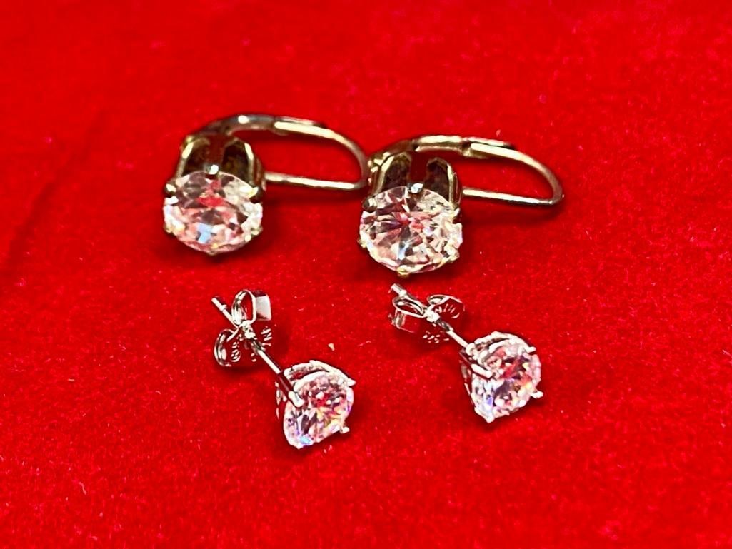 2 Pairs Sterling Silver CZ Earrings: This piece of jewelry as been tested and researched prior to testing . Please view all our pictures they are part of our description. DETAILS: Metal - Sterling 925 Color - Silver Stones - None Hallmar