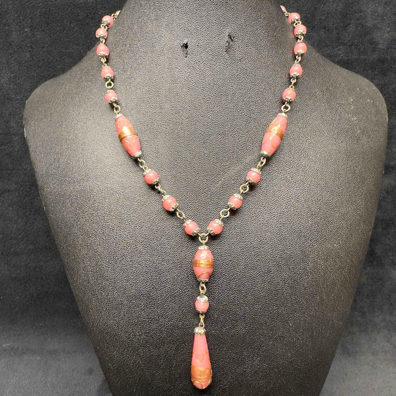 Murano Venetian Lamp Work Art Glass Pink Bead Copper Accent Beaded Pendant Dangle Necklace F95: Murano Venetian Lamp Work Art Glass Pink Bead Copper Accent Beaded Pendant Dangle Necklace F95. Necklace with pink colored glass beads with beautiful designs on each. The necklace features copper colo