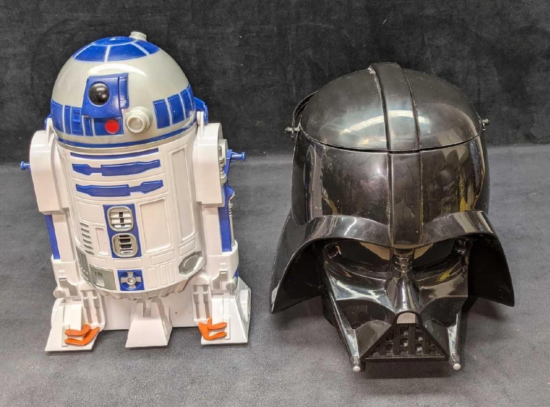 R2D2 & Darth Vader Disney Parks Popcorn Buckets: R2D2 & Darth Vader Disney Parks Popcorn Buckets. The R2D2 bucket is approx 7 1/4" x 5 1/2" x 11". The R2D2 bucket has some wear, markings and color loss. The helmet is approx 9" x 9" x 9 1/2". The tot