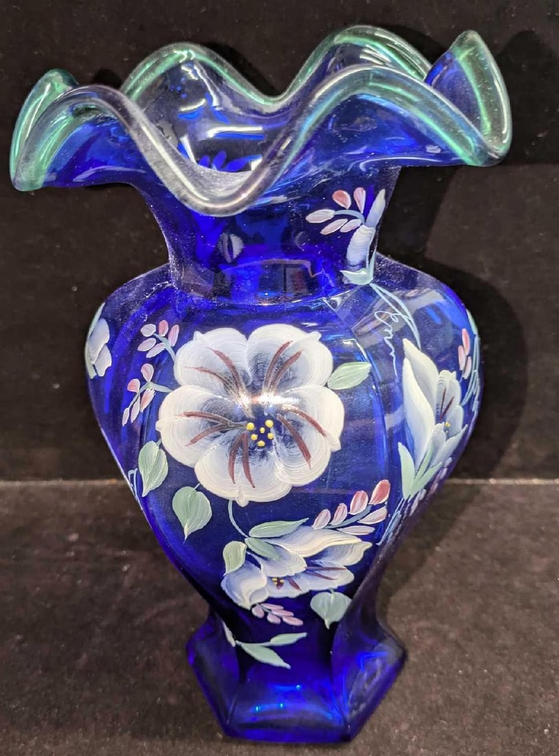 Fenton 75th Anniversary Hand Painted Blue Vase: Fenton 75th Anniversary Hand Painted Blue Vase. The vase was signed by the artist who painted it. The vase is approx 5" x 5" 9 3/8" and it weighs 2.16lbs. The vase has no chips or cracks. 