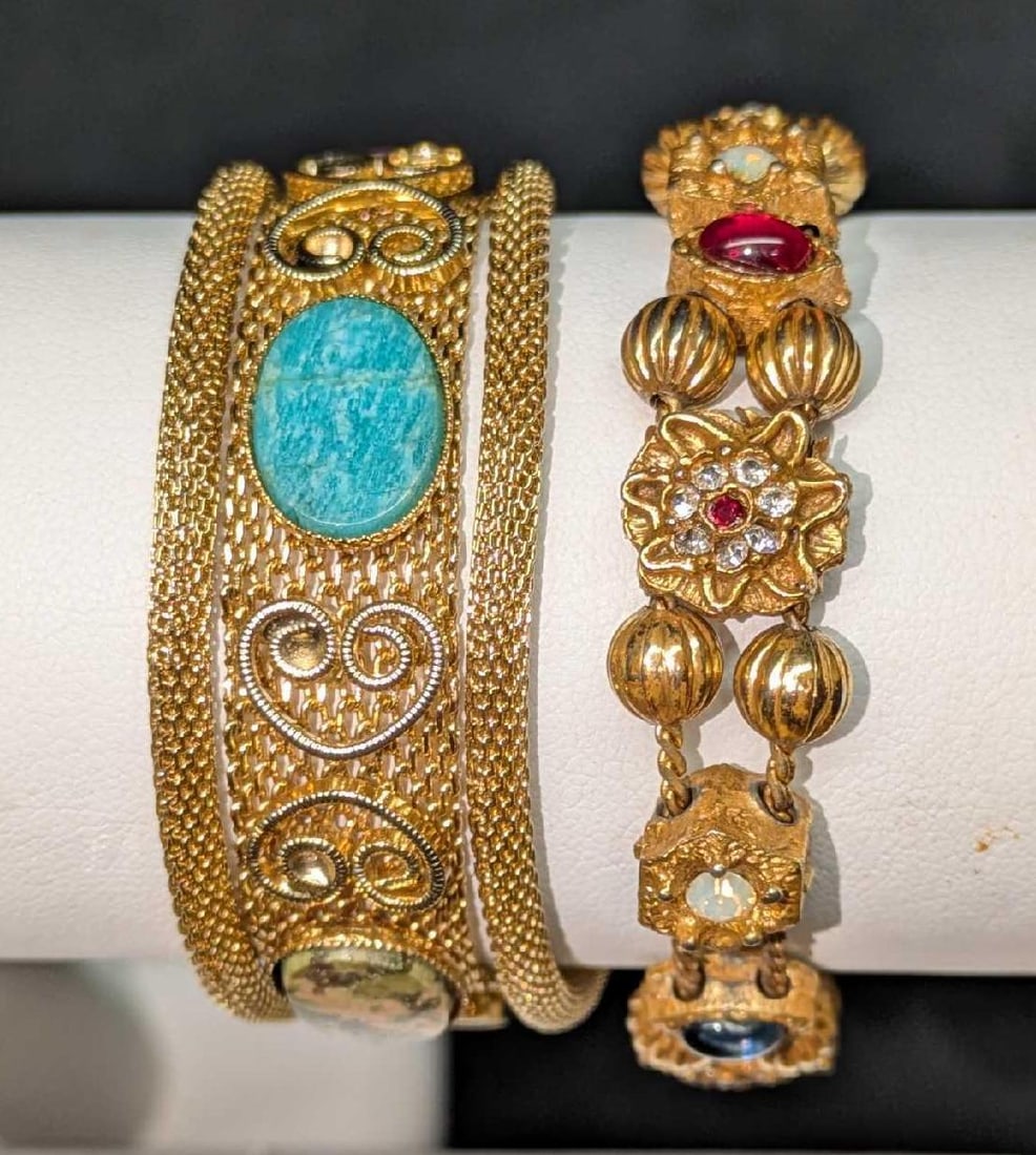 2 Vintage Gold Tone Three Strand And Slide Charm Bracelets: 2 Vintage Gold Tone Three Strand And Slide Charm Bracelets. This lot includes: (1) Mesh Gold Tone Three Strand Bracelet With Multi-Colored Stones. This is approx 7". (1) Gold Tone Slide Charm Bra
