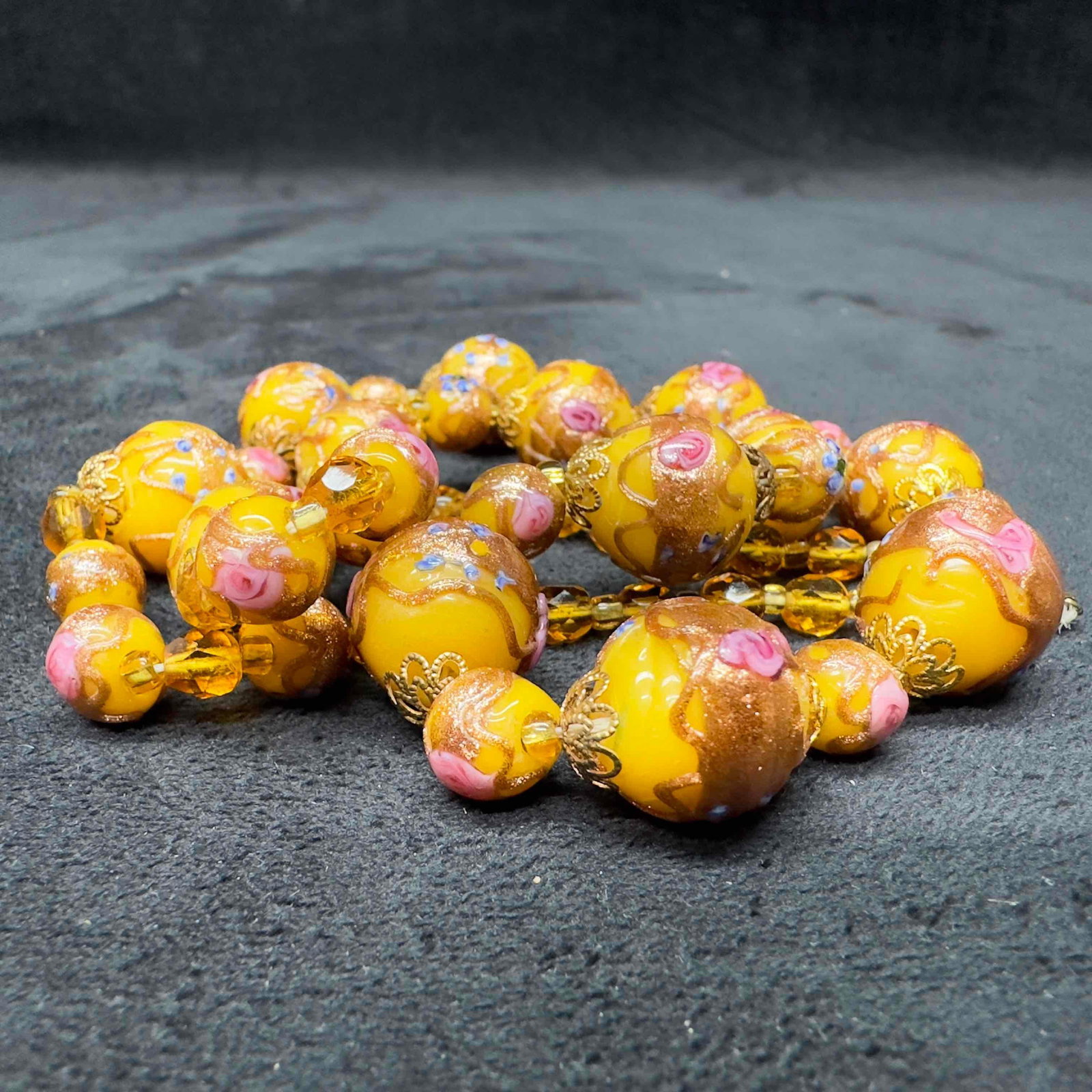 Murano Venetian Glass Lamp Work Floral Yellow Round Bead Beaded Necklace B41: Murano Venetian Glass Lamp Work Floral Yellow Round Bead Beaded Necklace B41. Necklace with yellow colored glass beads with beautiful hand painted designs on each. The necklace features floral accents