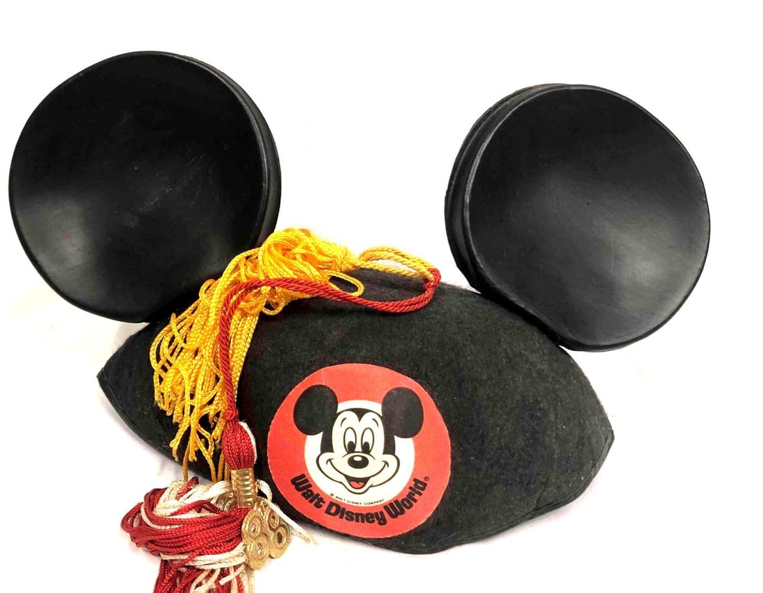 Vintage Mickey Mouse Hat With Graduation Tassel 1988: This lot contains a Vintage Mickey Mouse Graduation Cap With a 1988 Tassel. It is approx 6 3/4" x 8" x 6 1/4" and it weighs about 0.06lbs. The Tassel is a red and yellow or gold color and th