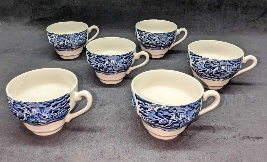 6 Liberty Blue Staffordshire Paul Revere Tea Cups: 6 Liberty Blue Staffordshire Paul Revere Tea Cups. Each cup is approx 4 1/2" x 4" x 2 5/8' and the total weight is 2.05 lbs. One of the cups has a chip on the top. Please see the images as they are pa