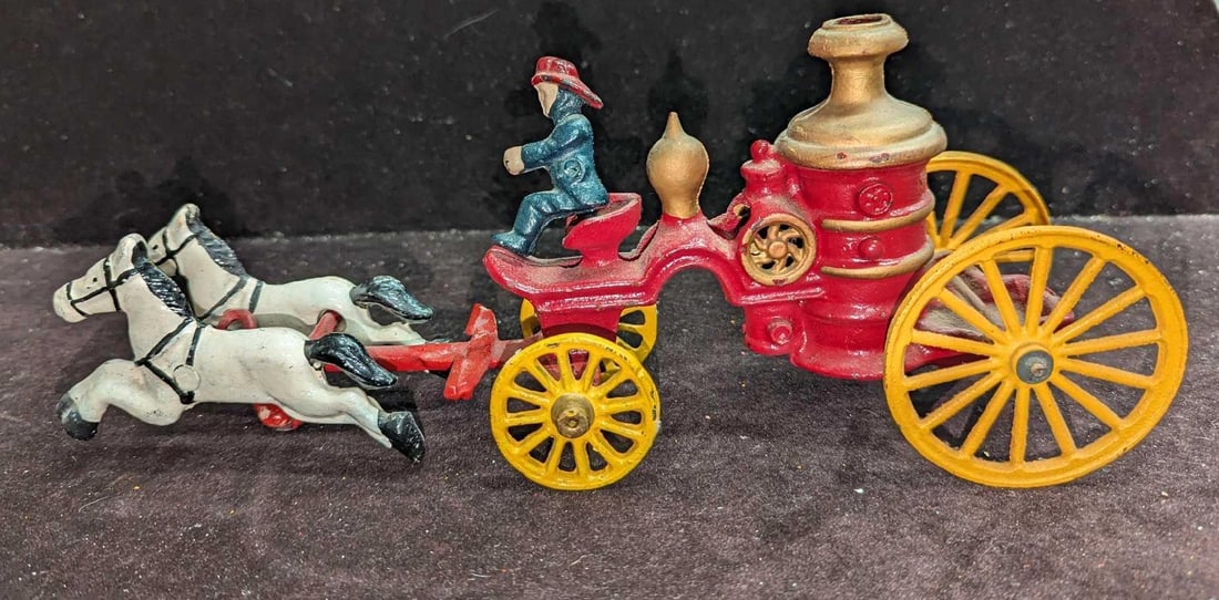 Vintage Cast Iron Fire Wagon Horse Pulled Toy J: Vintage Cast Iron Fire Wagon Horse Pulled Toy J. The fire engine is approx 7" x 3" x 4 3/4" and it weighs 1.26lb. The horses are approx 7 1/2" x 2 1/2" x 2 1/2" and it weighs 1.04lb. This has some chi