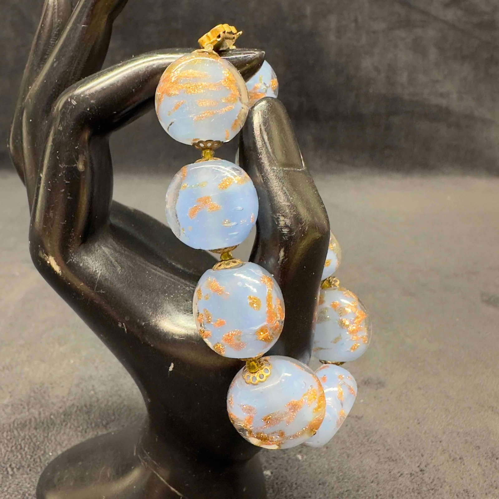 Murano Venetian Lamp Work Glass Light Blue Copper Accents Bead Bracelet B35: Murano Venetian Lamp Work Glass Light Blue Copper Accents Bead Bracelet B35. Bracelet with light blue colored glass beads with beautiful hand painted designs on each. The bracelet features copper acce