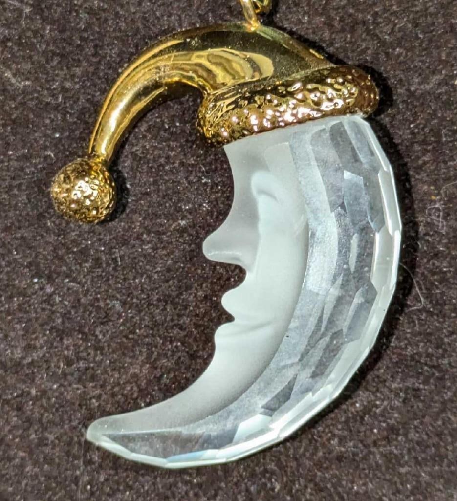 Retired Swarovski Christmas Memories Moon Ornament: Retired Swarovski Christmas Memories Moon Ornament. It comes in the original box that is approx 3 7/8" x 1 1/4" x 3 3/4" and it weighs 0.20lb. The ornament has no chips or cracks. The box has some she