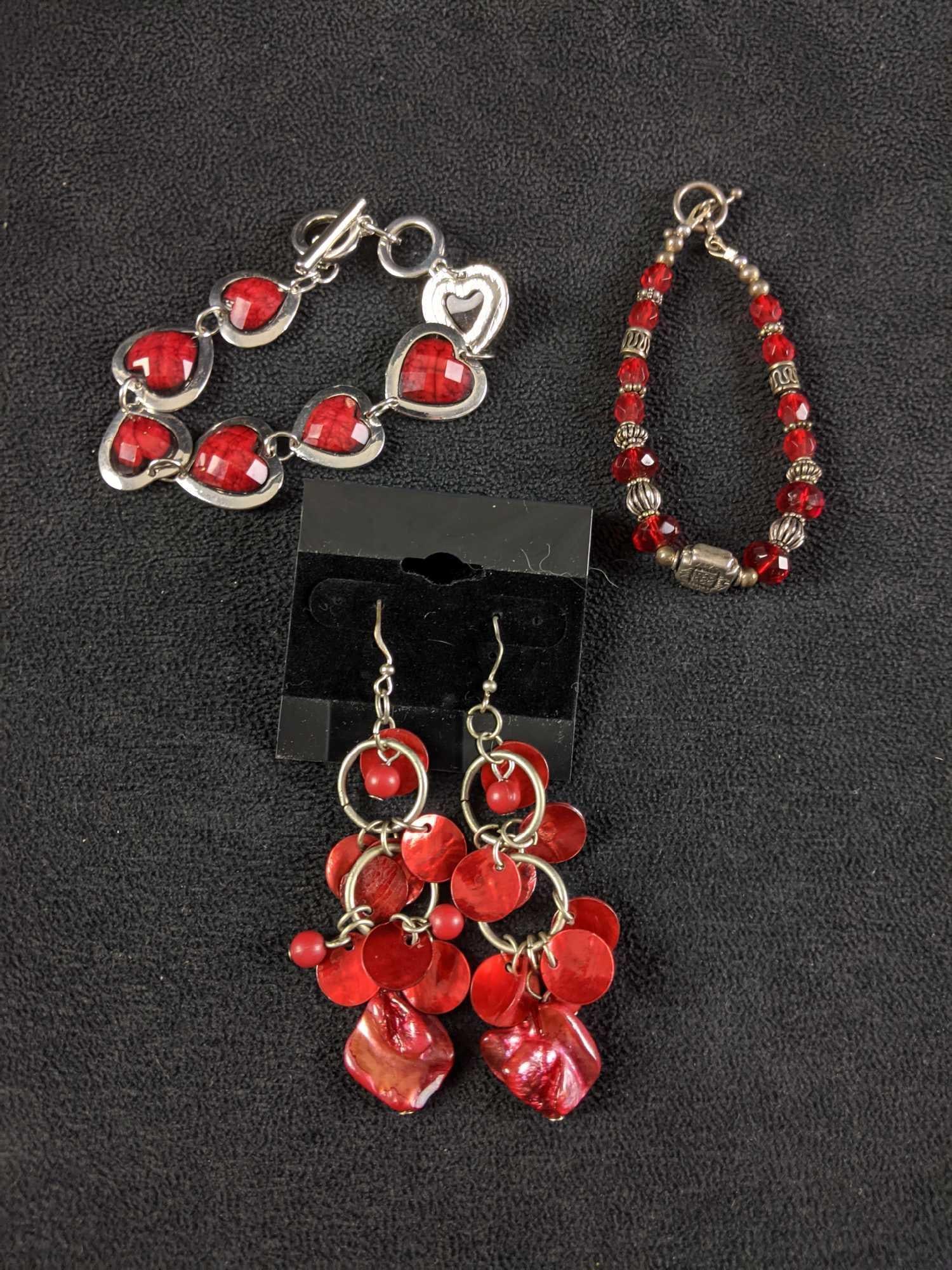 Red Bracelets and a Pair of Red Earrings: This set is the red set. We have Two red and silver-colored bracelets paired with red earrings All jewelry is in good condition with no known damage. This red pairing is nice and bright. Weight togeth