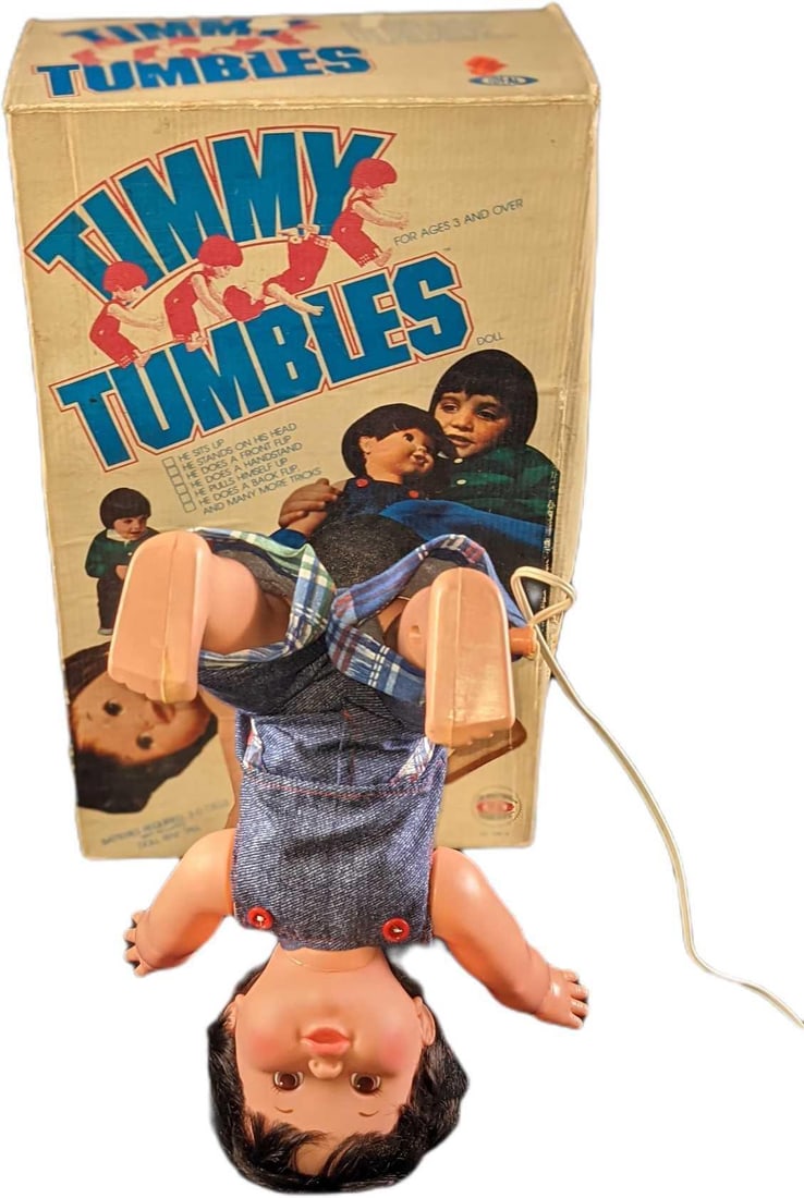 Vintage Timmy Tumbles With The Original Box: Here is "Timmy Tumbles" that doll sits up, stands on his head, does a front flip, does a handstand, pulls himself up, does a backflip, and many more tricks! This tumbling doll was released by Ideal To