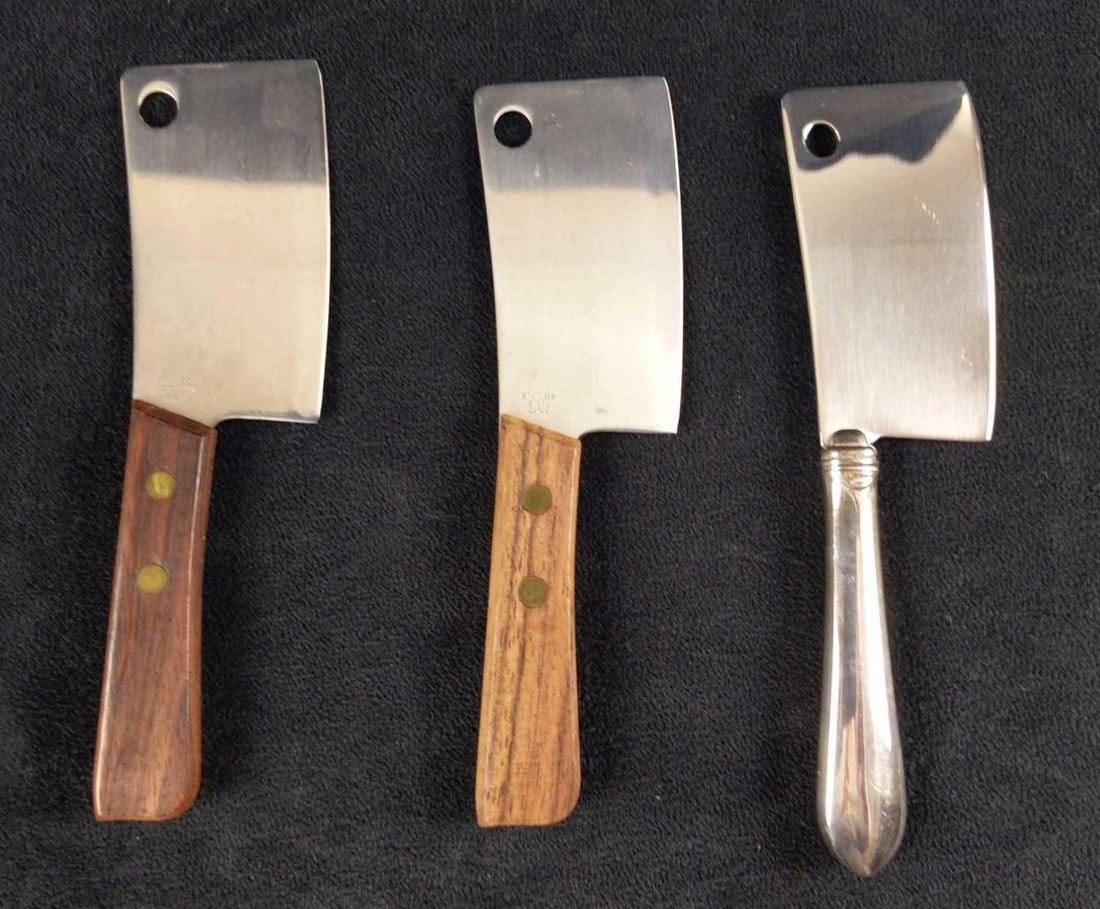 Three Vintage Stainless Steel Ckeavers: This lot consists of: (1) Gorham Stainless Steel Mini Cleaver. Is approx 2" x 6 1/2" (1) Stainless Steel Mini Cleaver With Light Wood Handle. Is approx 2" x 6". Is not marked with com