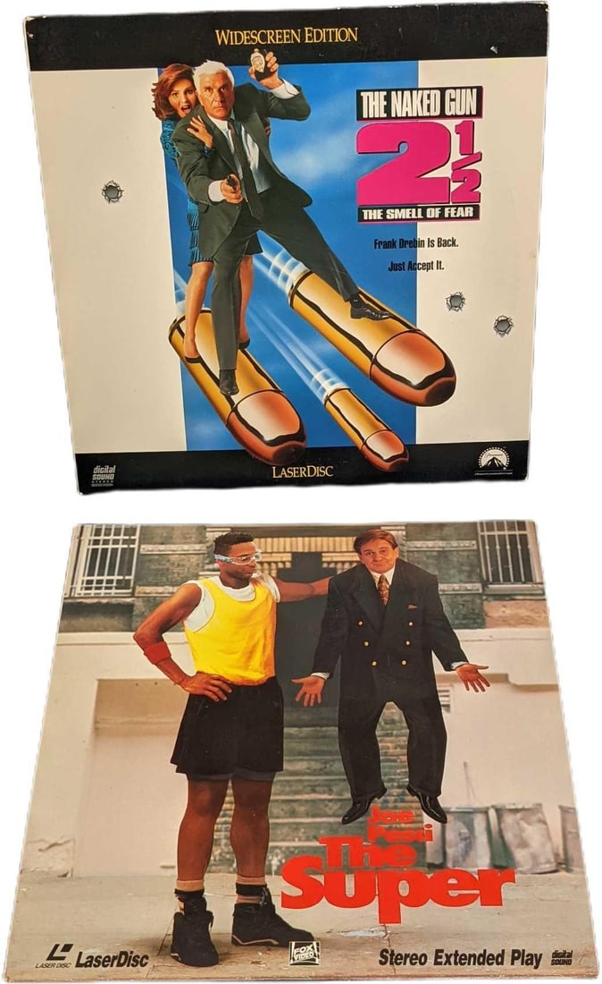 Naked Gun 2 1/2 & The Supe Laserdiscs: This lot includes: (1) Widescreen Version Of "The Naked Gun 2 1/2: The Smell Of Fear" This was released by Paramount in 1991. This is approx 12" x 12". (1) "The Super". This wa