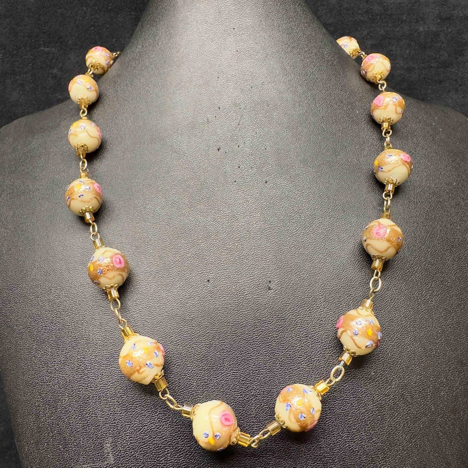 Venetian Murano Art Glass Lamp Work White Bead Floral Pink Fiorato Copper Accent Beaded Necklace E25: Venetian Murano Art Glass Lamp Work White Bead Floral Pink Fiorato Copper Accent Beaded Necklace E25. Necklace with white colored glass beads with beautiful hand painted designs on each. The necklace 