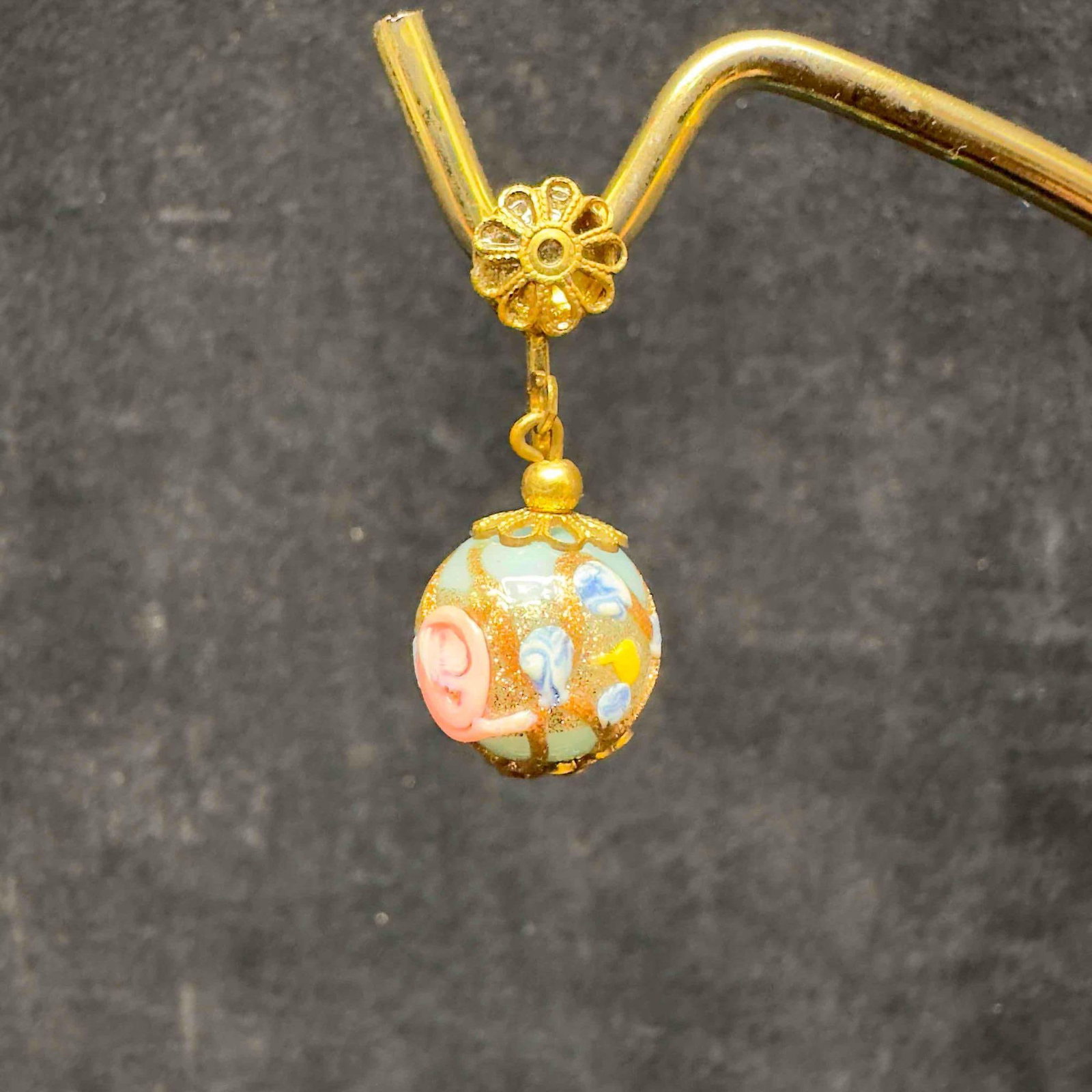 Murano Venetian Lamp Work Art Glass Light Blue Bead Floral Earrings E34: Murano Venetian Lamp Work Art Glass Light Blue Bead Floral Earrings E34. Earrings with light blue colored glass beads with beautiful hand painted designs on each. The earrings feature pink and copper 