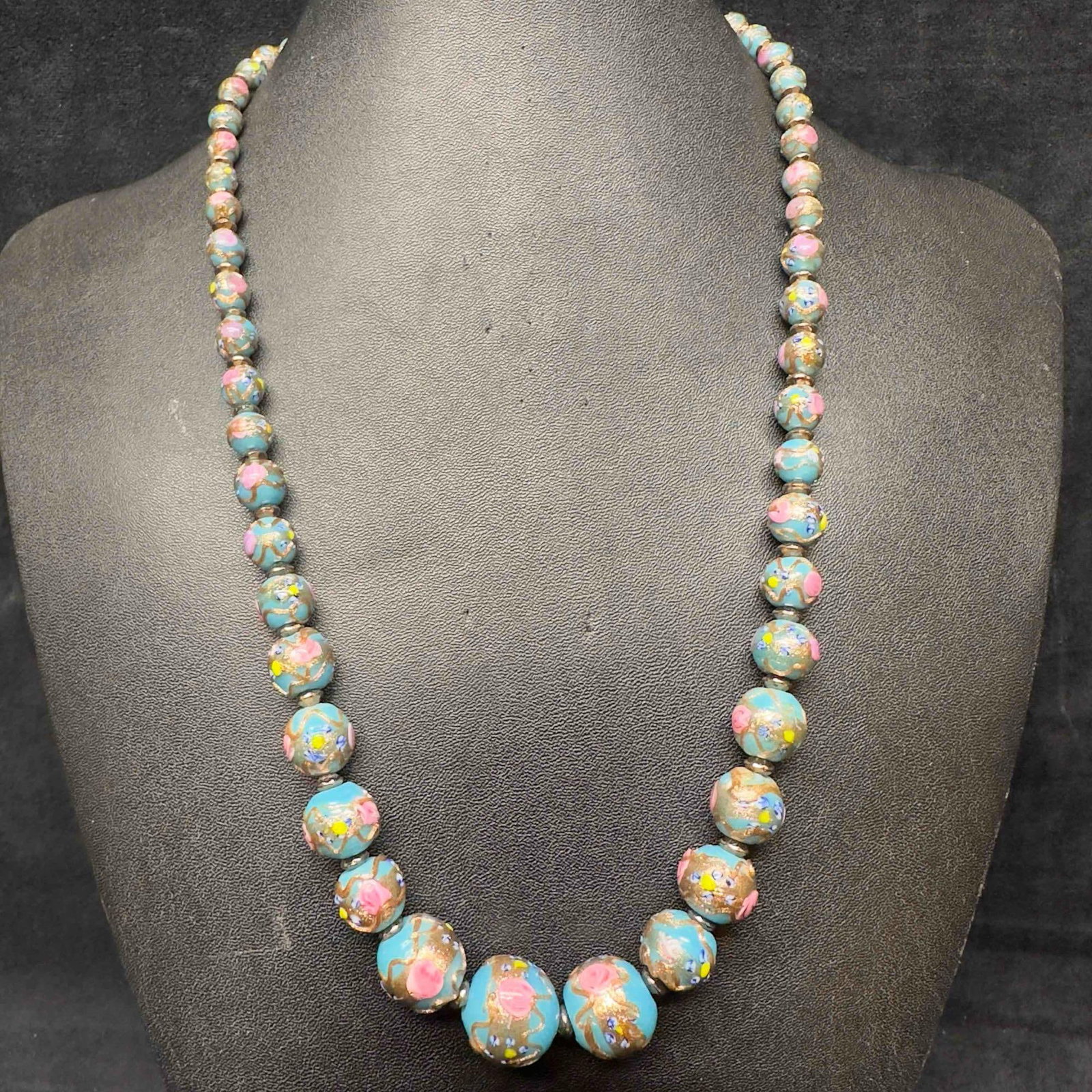 Venetian Murano Art Glass Lamp Work Blue Floral Bead Copper Pink Fiorato Beaded Necklace E41: Venetian Murano Art Glass Lamp Work Blue Floral Bead Copper Pink Fiorato Beaded Necklace E41. Necklace with blue colored glass beads with beautiful hand painted designs on each. The necklace features 