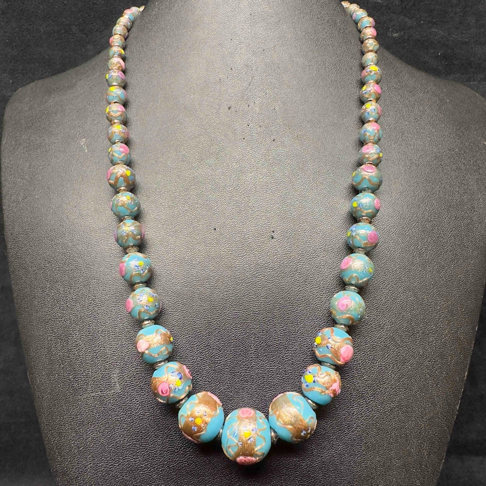 Venetian Murano Art Glass Lamp Work Blue Floral Bead Copper Pink Fiorato Beaded Necklace E43: Venetian Murano Art Glass Lamp Work Blue Floral Bead Copper Pink Fiorato Beaded Necklace E43. Necklace with blue colored glass beads with beautiful hand painted designs on each. The necklace features 