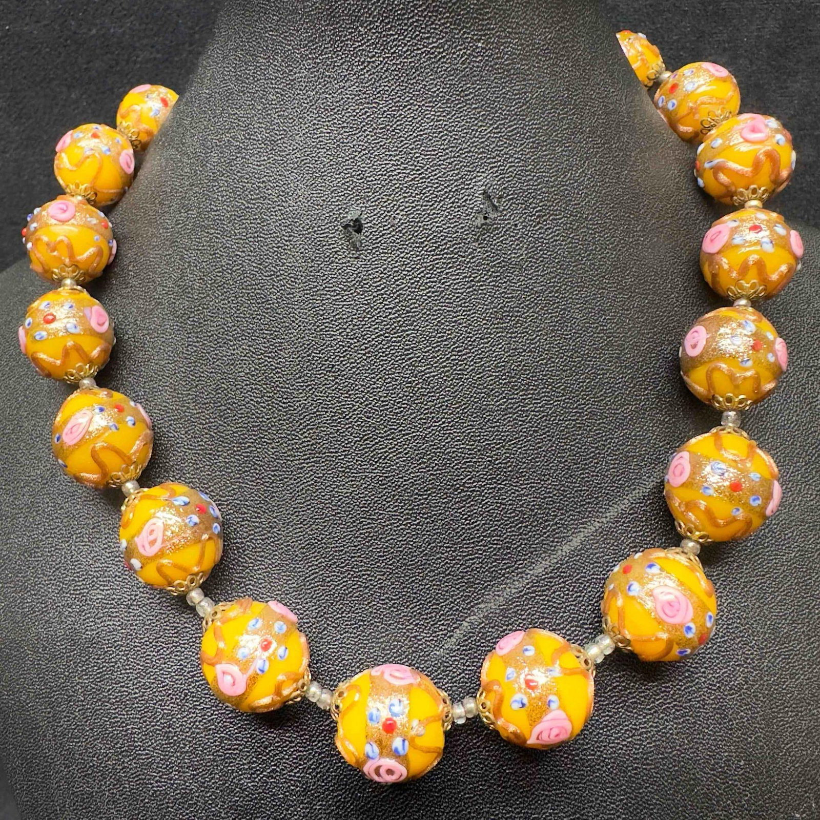 Venetian Murano Art Glass Lamp Work Yellow Floral Bead Copper Pink Fiorato Beaded Necklace E44: Venetian Murano Art Glass Lamp Work Yellow Floral Bead Copper Pink Fiorato Beaded Necklace E44. Necklace with yellow colored glass beads with beautiful hand painted designs on each. The necklace featu
