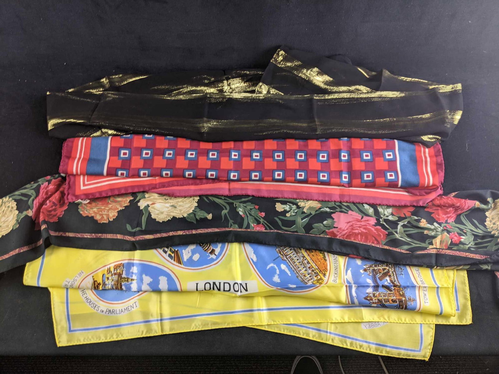 Four Assorted Accessory Scarves: Four Assorted Accessory Scarves These four scarves are the best accessory to add to your outfit. They are all in good condition. They are made from polyester or rayon. There are two rectangular scarve