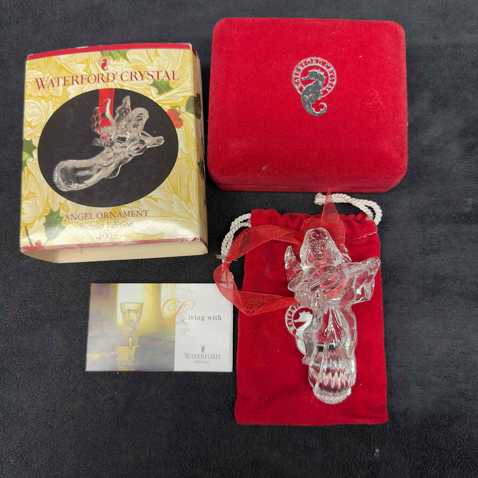 Waterford Crystal Glass Angel Ornament 2003 Second Edition: Waterford Crystal Glass Angel Ornament 2003 Second Edition. Original pouch and case included. This item is in good pre-owned, previously displayed condition with light wear, and surface scratches. Ple