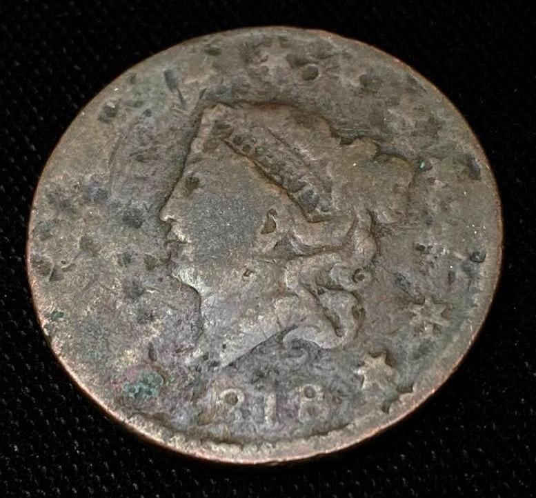 1818 US Penny: 1818 US Penny. United States one-cent coin, from 1818. This penny definitely shows its age, but the date is readable as well as the "liberty" in the crown of Columbia.