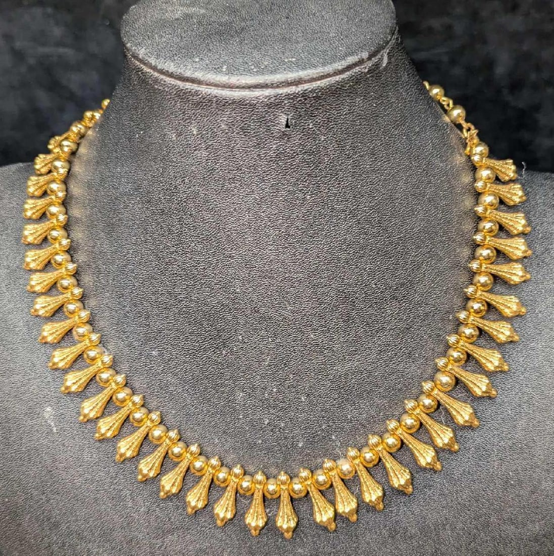 Vintage Trifari Egyptian Style Gold Tone Collar Necklace: Vintage Trifari Egyptian Style Gold Tone Collar Necklace. With gold tone faux pearls. This is approx 18" and it weighs 0.16lb. The clasp has some signs of wear.