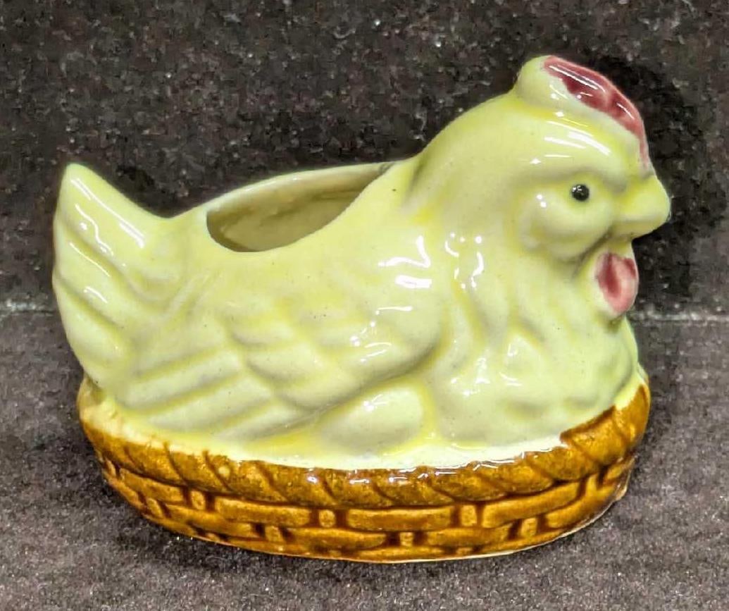 Vintage Ceramic Chicken In A Nest Toothpick Holder: Vintage Ceramic Chicken In A Nest Toothpick Holder. Made in Japan. This is approx 3 1/4" x 2 1/8" x 2 1/4" and it weighs 0.12lb. The inside of the holder has some residue.
