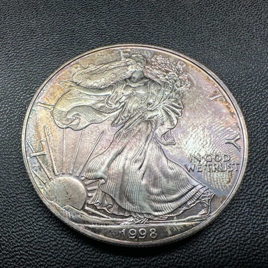 Toned .999 Silver American Silver Eagle Coin 1998: These coins have been tested and researched to the best of our ability prior to listing. Please view photos, as they are a part of the condition. DETAILS: Metal - .999 Pure Silver Tested - Yes Size -