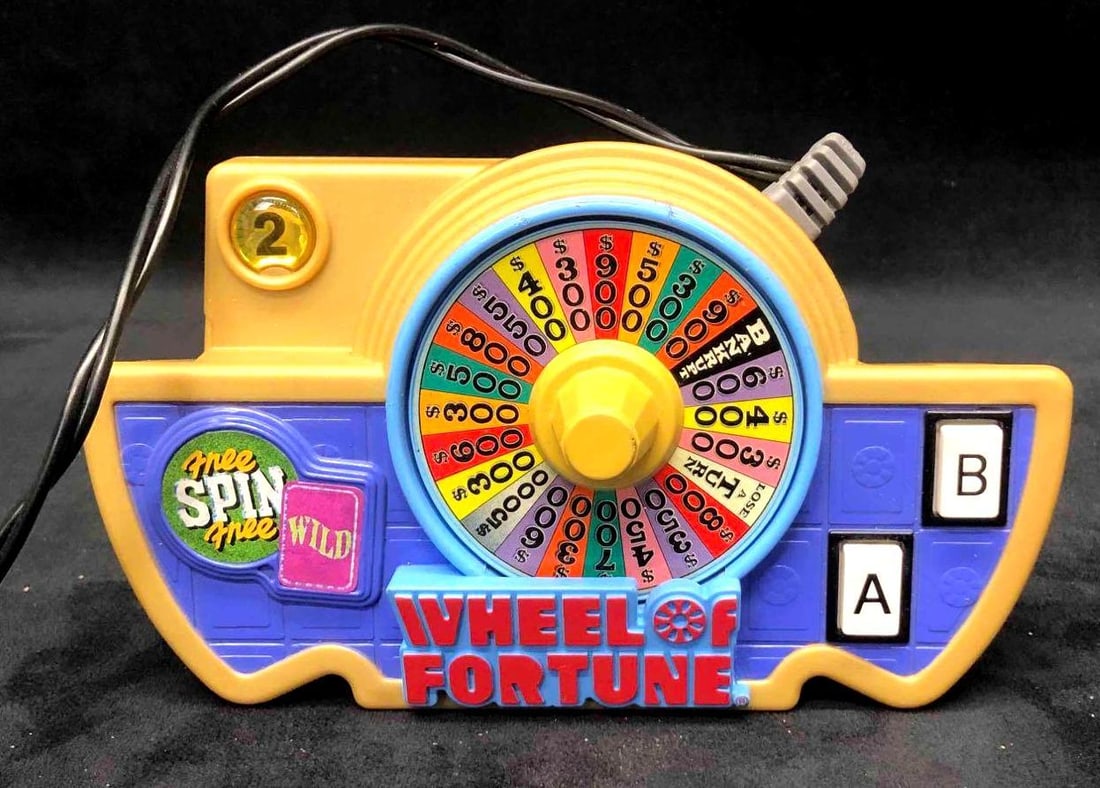 Wheel Of Fortune Plug & Play Jakks Pacific 2007: This lot contains a Wheel Of Fortune Plug & Play Jakks Pacific 2007. It is approx BLANK and weighs about 0.7lbs. This is the perfect gift for any gamer or as use as nostalgic decor in a playroom. Item