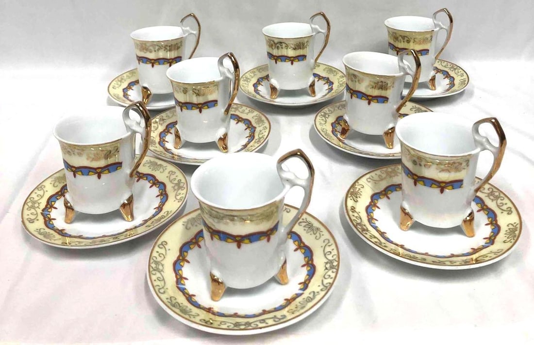 Decorative 16 Piece China Set With Gold Design: This lot contains a decorative 16 piece China set with a gold design. The set includes 8 plates and 8 tea cups. The plates can stack together easily for storage. This set is strictly for decorati
