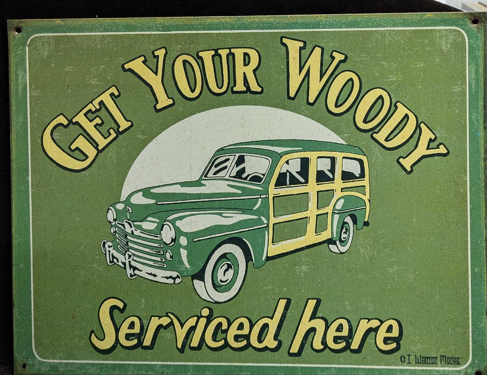 Retro Style Get Your Woody Serviced Here Tin Sign: Retro Style Get Your Woody Serviced Here Tin Sign. This is approx 16" x 12 1/2" and it weighs 0.75lb. The sign has some markings from age and use along with some scratches on the back.